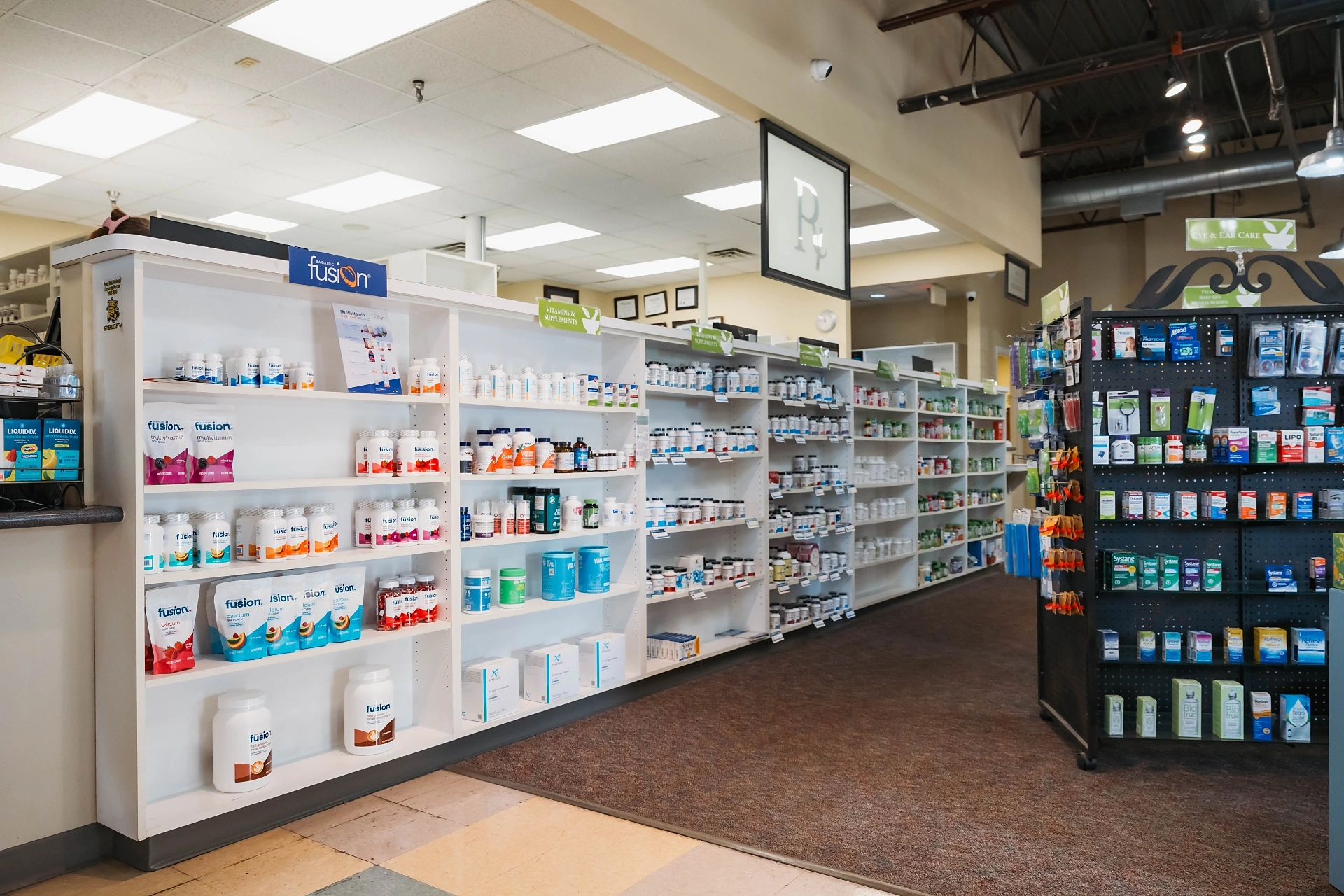 Vitamin, supplement and over-the-counter aisles inside Dandurand Drugstore East in Wichita, KS